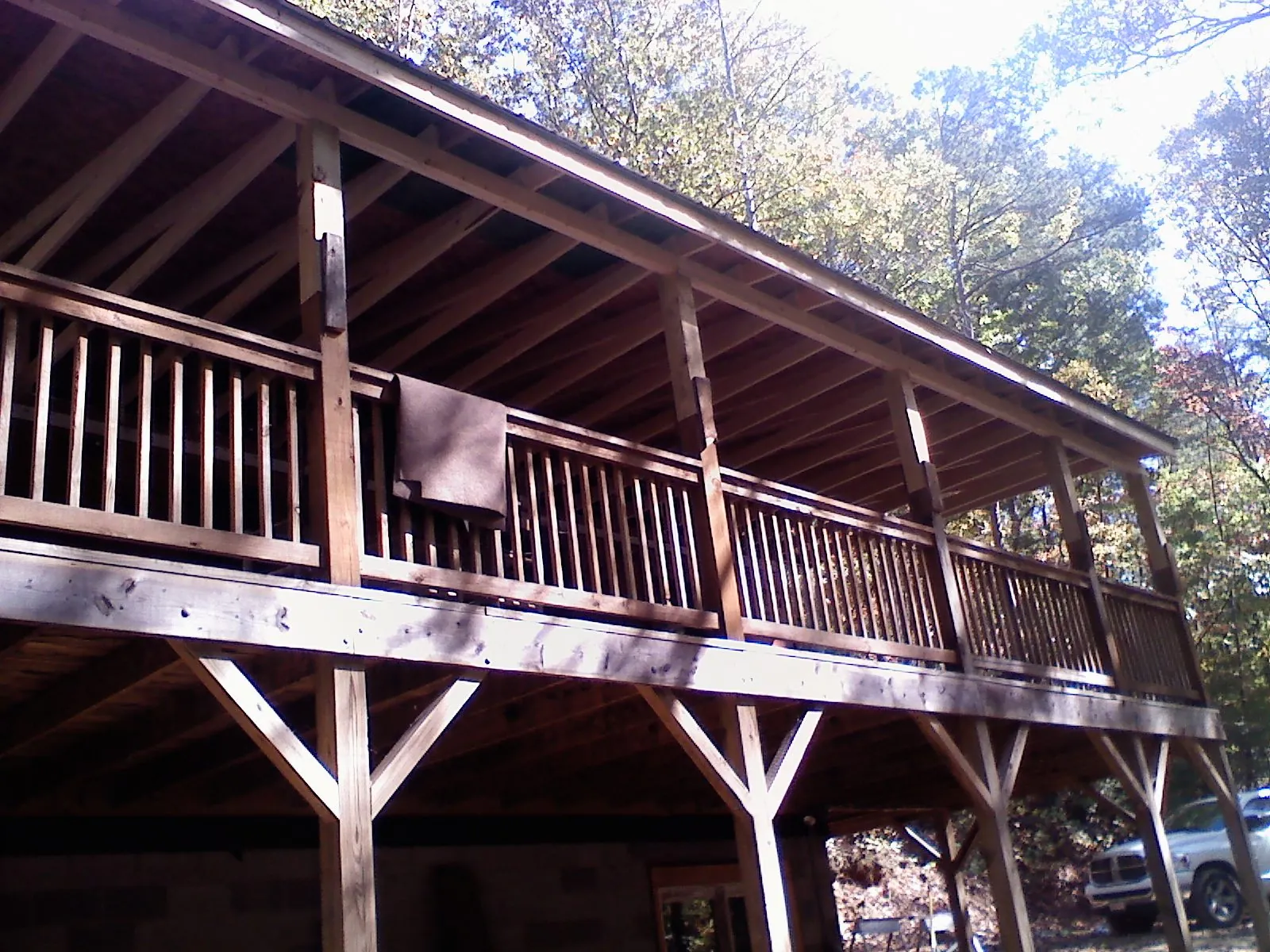 Timber framing under a new elevated porch and deck — Roof Leak Repair in South Windsor by Roofing Brothers